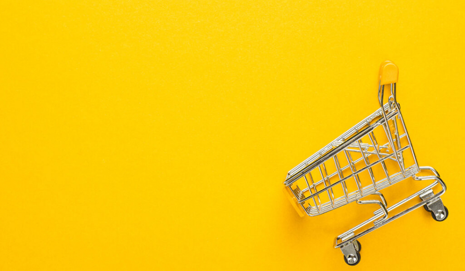 shopping-trolley-on-yellow-background-PEHJ75X-1024x682